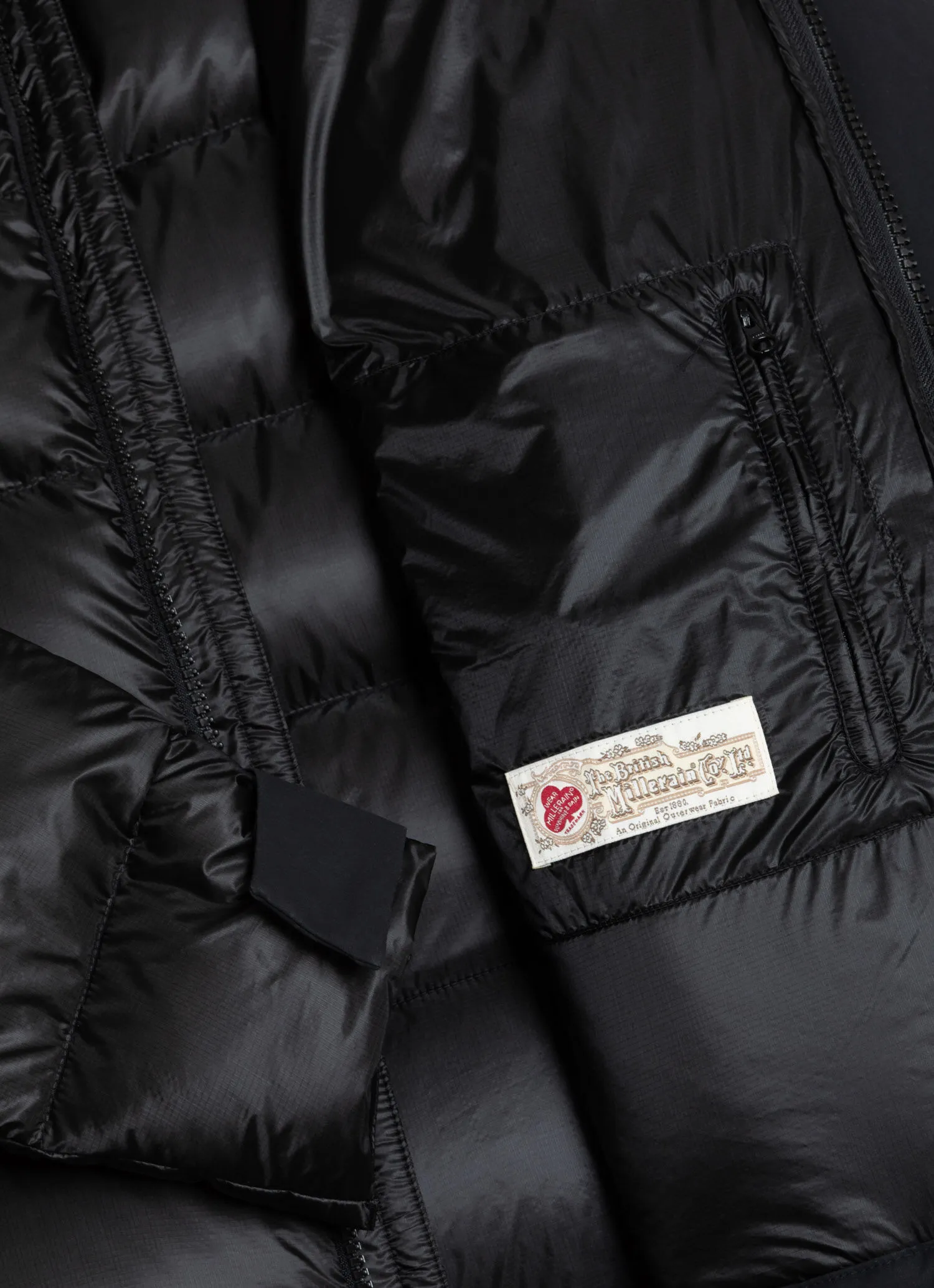 Down jacket with waxed sleeves-